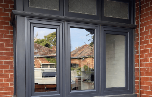 Anthracite grey uPVC double glazed windows installed in heritage brick home in St Kilda Melbourne by Windows Republic